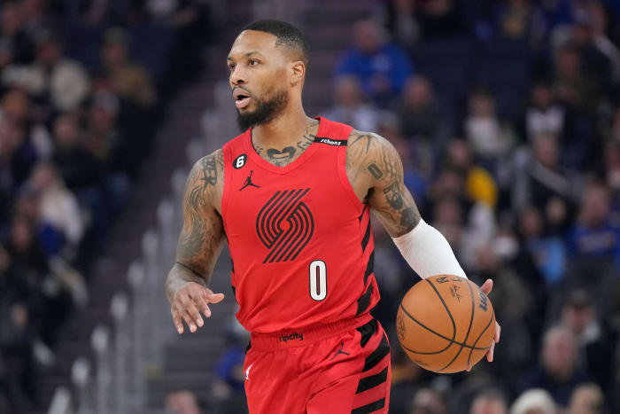 Portland Trail Blazers guard Damian Lillard brings the ball up the court against the Golden State Warriors.